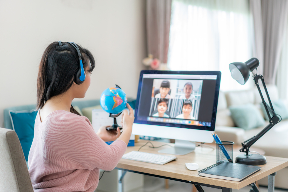 Little girl attending an online class